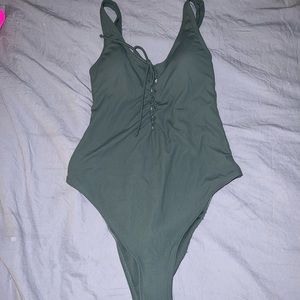 Green one piece bathing suit